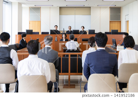 A scene from a Japanese courtroom where a trial takes place. A scene from a Japanese courtroom where a trial takes place. 141952186