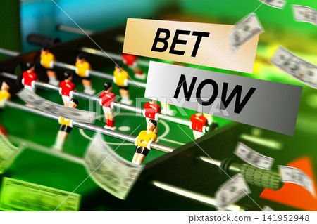 Sport betting scene with cash and foosball table at a local bar during a game night Sport betting scene with cash and foosball table at a local bar during a game night 141952948