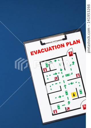 Emergency evacuation plan showing routes and exits in a building with emergency signs for safety 141953266