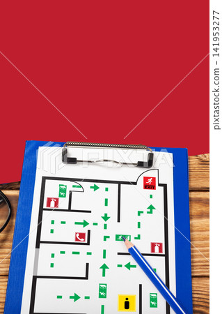 Emergency evacuation plan showing exit routes and safe areas for building occupants Emergency evacuation plan showing exit routes and safe areas for building occupants 141953277