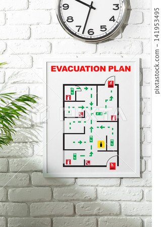 Emergency evacuation plan displayed on wall with clock showing time Emergency evacuation plan displayed on wall with clock showing time 141953495