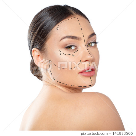 Woman showing facial contour design for cosmetic procedure in a studio setting Woman showing facial contour design for cosmetic procedure in a studio setting 141953500