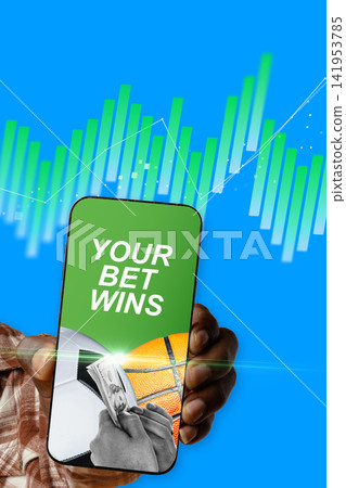 Hand holding smartphone displaying winning sports bet with rising graphics in background Hand holding smartphone displaying winning sports bet with rising graphics in background 141953785