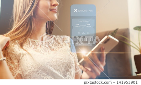 Travel booking process with a boarding pass displayed on a smartphone screen showing departure from London Travel booking process with a boarding pass displayed on a smartphone screen showing departure from London 141953901