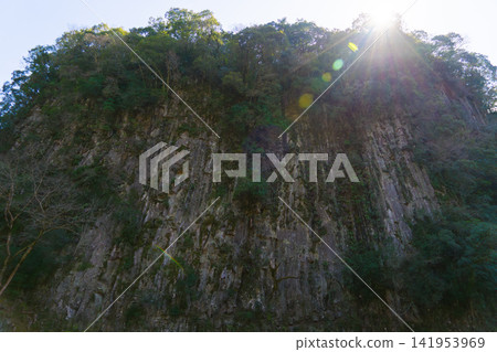 The Hermit's Screen Rock in Takachiho Gorge, bathed in sunlight. The Hermit's Screen Rock in Takachiho Gorge, bathed in sunlight. 141953969