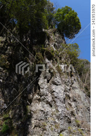 The Hermit's Screen Rock of Takachiho Gorge rises into the blue sky. The Hermit's Screen Rock of Takachiho Gorge rises into the blue sky. 141953970