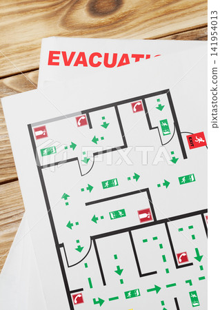 Emergency evacuation plan showing exit routes and assembly points Emergency evacuation plan showing exit routes and assembly points 141954013