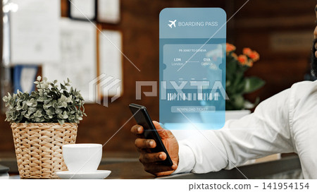 Travel booking in a cafe with a digital boarding pass on smartphone Travel booking in a cafe with a digital boarding pass on smartphone 141954154