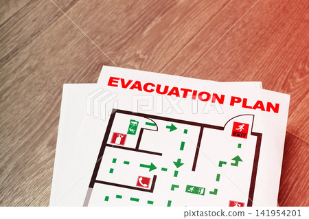 Emergency 911 evacuation plan document with clear escape routes and exit signs for public safety in case of urgent situations Emergency 911 evacuation plan document with clear escape routes and exit signs for public safety in case of urgent situations 141954201