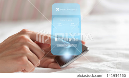 Travel booking for a flight from London to Geneva using a mobile device at home in the morning Travel booking for a flight from London to Geneva using a mobile device at home in the morning 141954360