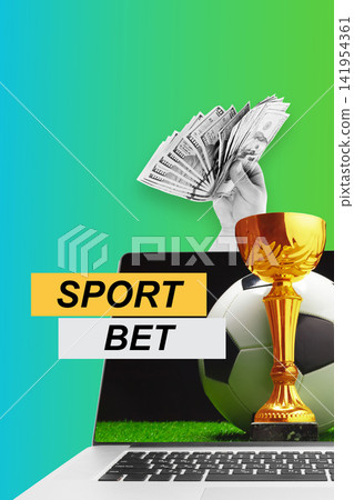 Sports betting on a laptop with cash and a trophy in view Sports betting on a laptop with cash and a trophy in view 141954361
