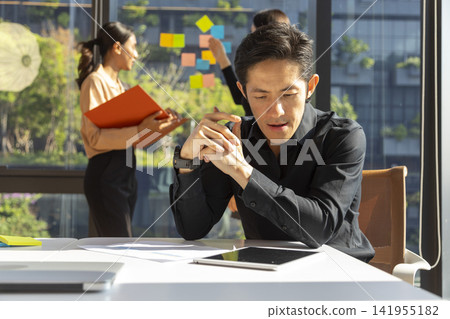 Two business woman presenting working project on the window of office building. Business, people, teamwork and planning concept. Two business woman presenting working project on the window of office building. Business, people, teamwork and planning concept. 141955182