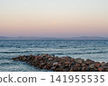 Blue waters of the Red Sea near Dahab, Egypt on the sunrise. Sinai mountains rise in the background under a clear sky. 141955535