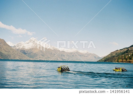 Jet boats on Lake Queenstown, New Zealand Jet boats on Lake Queenstown, New Zealand 141956141
