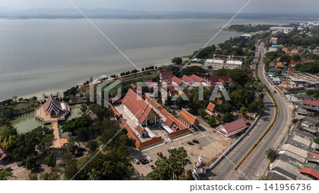 Aerial view of Wat Sri Khom Kham temple and Phayao lake in Phayao province of Thailand. This lake is the largest freshwater lake in Northern Thailand and the fourth largest in the country. Aerial view of Wat Sri Khom Kham temple and Phayao lake in Phayao province of Thailand. This lake is the largest freshwater lake in Northern Thailand and the fourth largest in the country. 141956736