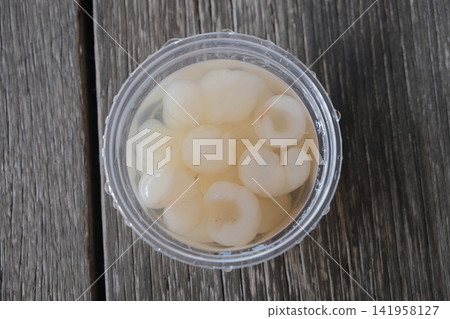 Longan juice in a clear plastic glass Longan juice in a clear plastic glass 141958127