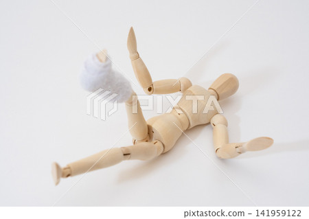 A drawing mannequin with a broken leg and a cast. A drawing mannequin with a broken leg and a cast. 141959122