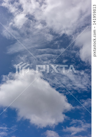A blue sky with various kinds of clouds floating in it A blue sky with various kinds of clouds floating in it 141959813
