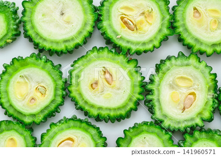 Cross-section of a fresh bitter melon slice Cross-section of a fresh bitter melon slice 141960571