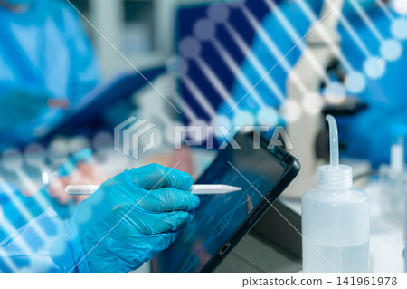 Microbiologists and nutrition experts analyze molecular samples in advanced food science labs. Microbiologists and nutrition experts analyze molecular samples in advanced food science labs. 141961978