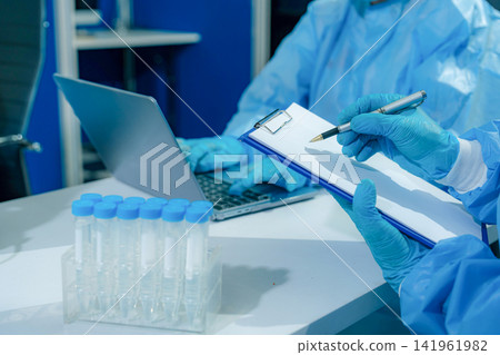 Microbiologists and nutrition experts analyze molecular samples in advanced food science labs. Microbiologists and nutrition experts analyze molecular samples in advanced food science labs. 141961982