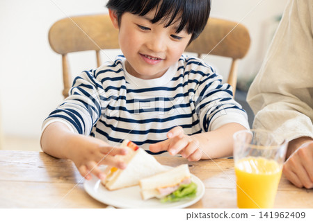 Boy having breakfast Boy having breakfast 141962409