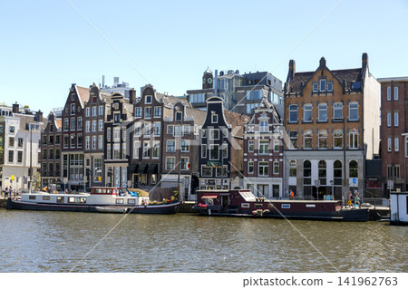 Amsterdam, Netherlands - July 02, 2018: The embankment of the Amstel River in the center of Amsterdam 141962763