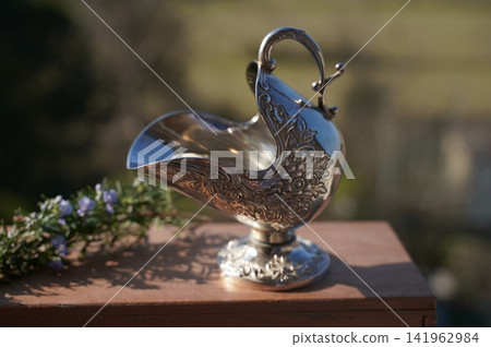 Ornate Silver Jug with Intricate Floral Design Ornate Silver Jug with Intricate Floral Design 141962984