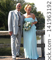 Mature Couple Joyfully Poses on Their Wedding Day 141963192