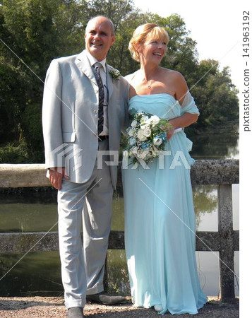 Mature Couple Joyfully Poses on Their Wedding Day Mature Couple Joyfully Poses on Their Wedding Day 141963192