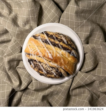 Soft chocolate cinnamon roll with rich cocoa swirls and a tender, fluffy texture. Sweet, aromatic, and indulgent, offering a warm bakery feel perfect for cozy dessert moments. 141963624