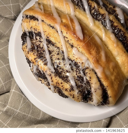 Soft chocolate cinnamon roll with rich cocoa swirls and a tender, fluffy texture. Sweet, aromatic, and indulgent, offering a warm bakery feel perfect for cozy dessert moments. 141963625