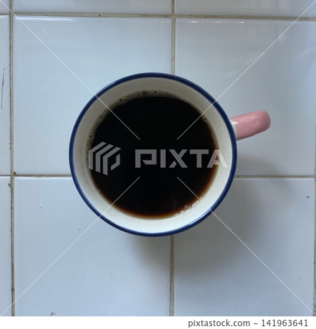Freshly brewed black coffee with a deep aroma and bold, rich flavor. Smooth and comforting, capturing a quiet moment of warmth and focus in every sip. Freshly brewed black coffee with a deep aroma and bold, rich flavor. Smooth and comforting, capturing a quiet moment of warmth and focus in every sip. 141963641