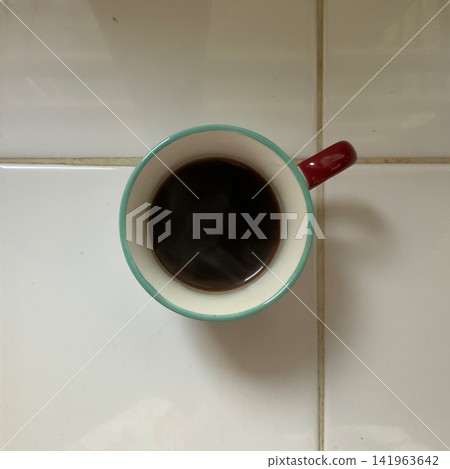 Freshly brewed black coffee with a deep aroma and bold, rich flavor. Smooth and comforting, capturing a quiet moment of warmth and focus in every sip. Freshly brewed black coffee with a deep aroma and bold, rich flavor. Smooth and comforting, capturing a quiet moment of warmth and focus in every sip. 141963642