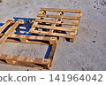 Old Wooden Pallets on Gray Cement Ground. 141964042