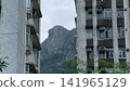 Hong Kong July 19 2026 Lion Rock framed by apartment buildings. 141965129