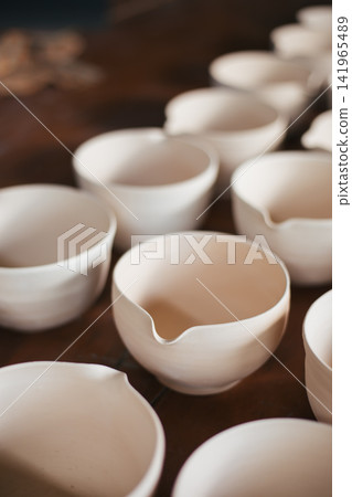 The process of creating pottery. The process of creating pottery. 141965489