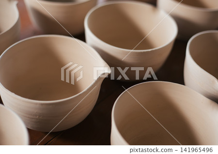 The process of creating pottery. The process of creating pottery. 141965496