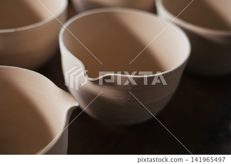 The process of creating pottery. The process of creating pottery. 141965497