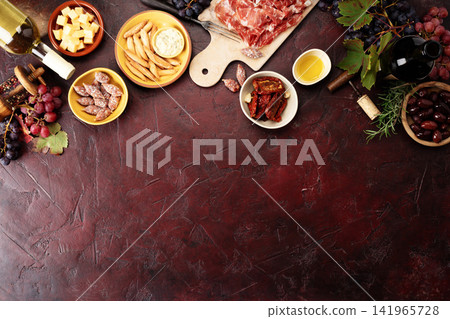 Wine and Charcuterie Corner on Dark Rustic Background Wine and Charcuterie Corner on Dark Rustic Background 141965728