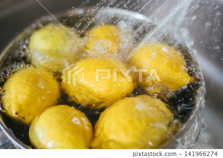 Washing fresh lemons Washing fresh lemons 141966274