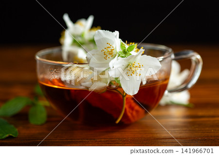 aromatic jasmine flower tea with floral decoration aromatic jasmine flower tea with floral decoration 141966701