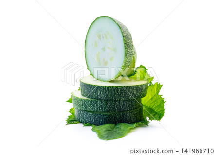 Healthy zucchini slices with edible flowers on bright white background Healthy zucchini slices with edible flowers on bright white background 141966710
