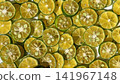 Close-up background photo with slices of shikwasa fruit laid out. 141967148