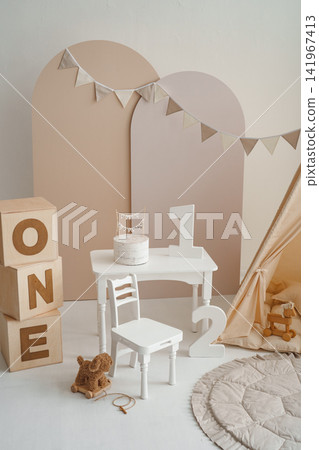 First birthday photo zone with cake on white table, ONE wooden blocks and number one First birthday photo zone with cake on white table, ONE wooden blocks and number one 141967413