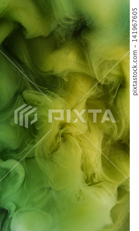 Smoke fluid blur. Fume wave. Green yellow curl paint spreading underwater blending liquid color on dark abstract texture background. Smoke fluid blur. Fume wave. Green yellow curl paint spreading underwater blending liquid color on dark abstract texture background. 141967605