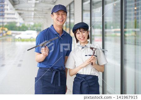 A building maintenance staff member smiles directly at the camera. A building maintenance staff member smiles directly at the camera. 141967915