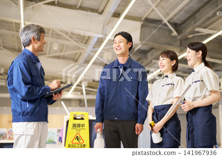 Cleaning staff meeting with smiles on their faces Cleaning staff meeting with smiles on their faces 141967936