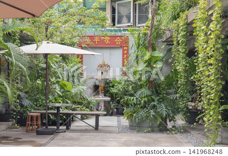 A tranquil, secret garden courtyard where heritage design, sacred traditions, and lush tropical botany peacefully coexist. A tranquil, secret garden courtyard where heritage design, sacred traditions, and lush tropical botany peacefully coexist. 141968248