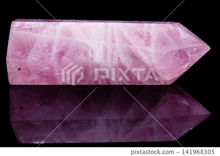 Macro mineral pink quartz crystal on a black background Macro mineral pink quartz crystal on a black background 141968305